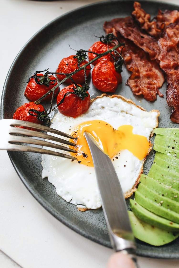 Sunny Side Up Eggs with Bacon, Avocado and Cherry Tomatoes Recipe